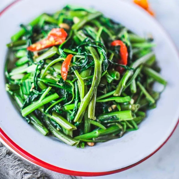 Cambodian Stir-Fried Water Spinach with Pork, Fermented Soybeans, and Garlic